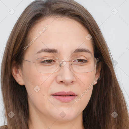 Joyful white adult female with long  brown hair and brown eyes