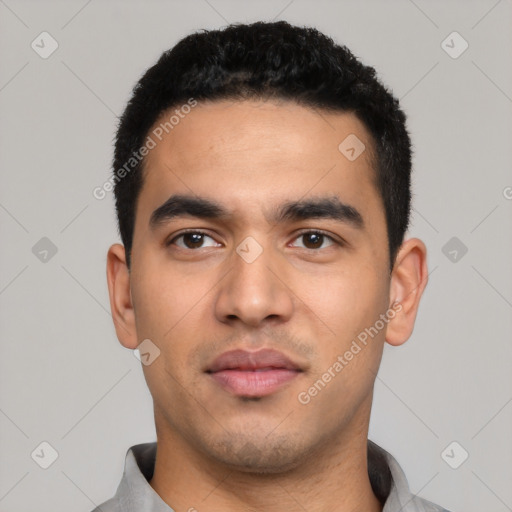 Neutral latino young-adult male with short  black hair and brown eyes