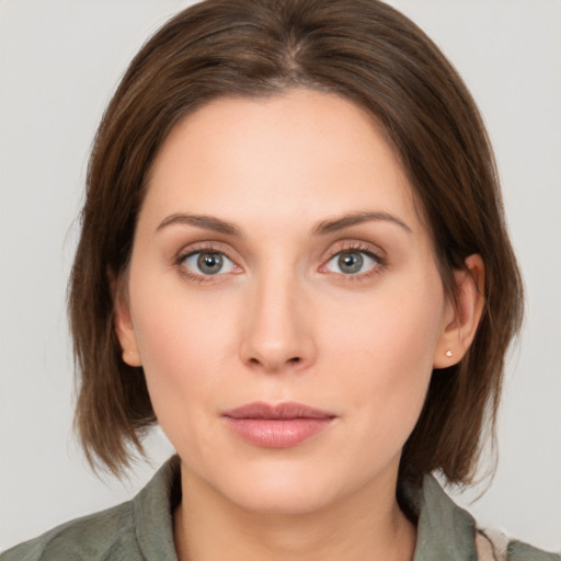 Neutral white young-adult female with medium  brown hair and green eyes