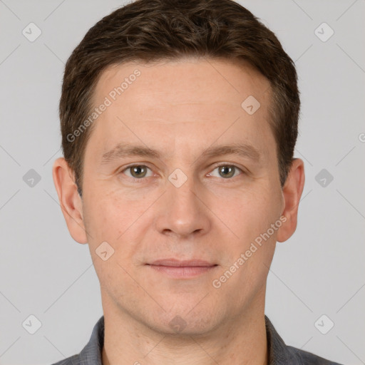 Joyful white adult male with short  brown hair and grey eyes