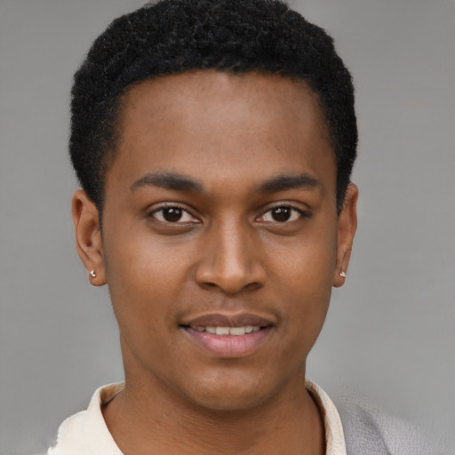 Joyful latino young-adult male with short  brown hair and brown eyes
