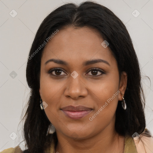 Joyful black young-adult female with long  brown hair and brown eyes