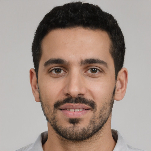 Neutral latino young-adult male with short  black hair and brown eyes