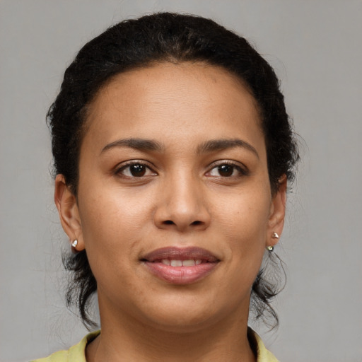 Joyful latino young-adult female with short  brown hair and brown eyes