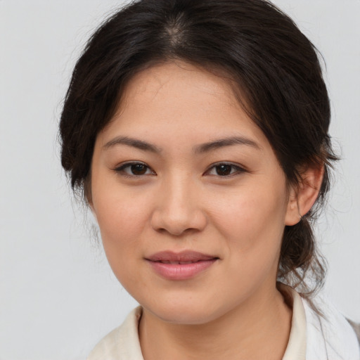 Joyful white young-adult female with medium  brown hair and brown eyes