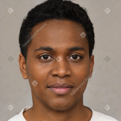 Joyful black young-adult male with short  black hair and brown eyes