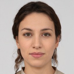 Neutral white young-adult female with medium  brown hair and brown eyes