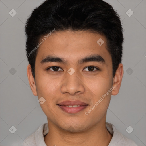 Joyful latino young-adult male with short  brown hair and brown eyes