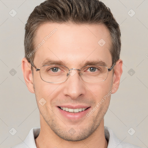 Joyful white adult male with short  brown hair and brown eyes