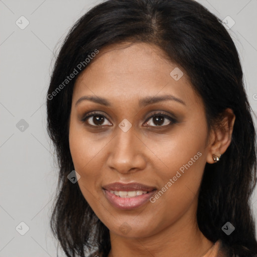 Joyful black young-adult female with long  brown hair and brown eyes