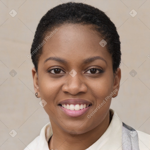 Joyful black young-adult female with short  brown hair and brown eyes