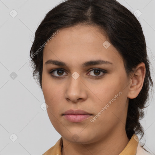 Joyful latino young-adult female with long  brown hair and brown eyes