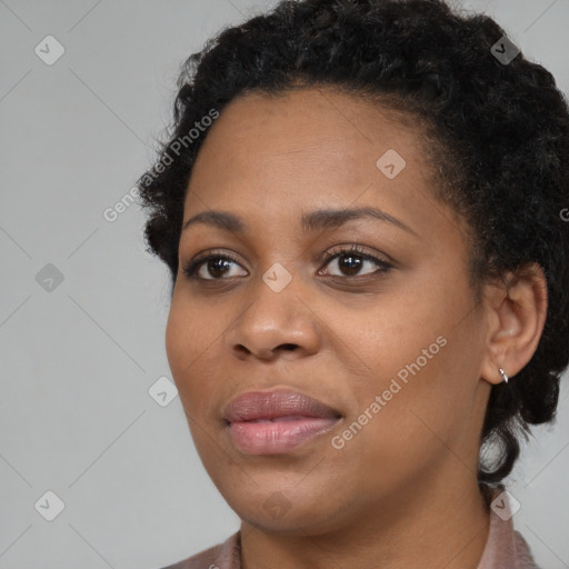 Joyful black young-adult female with medium  black hair and brown eyes