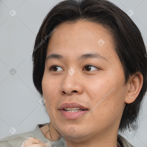 Joyful asian young-adult female with medium  brown hair and brown eyes