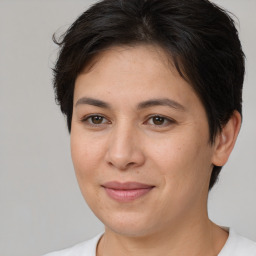 Joyful white young-adult female with medium  brown hair and brown eyes