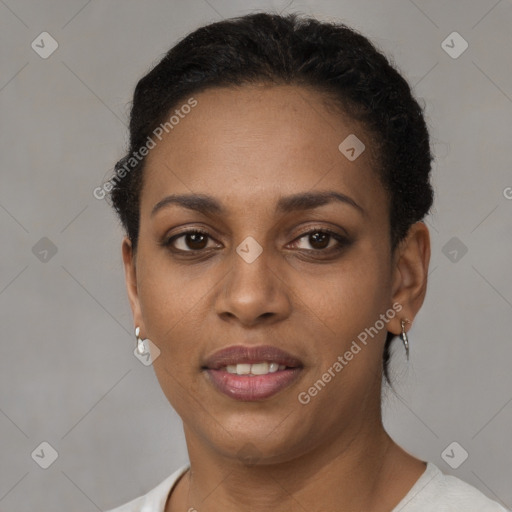 Joyful black young-adult female with short  brown hair and brown eyes