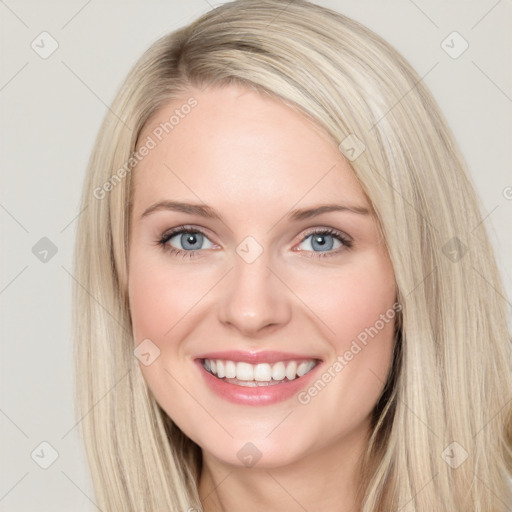 Joyful white young-adult female with long  brown hair and blue eyes