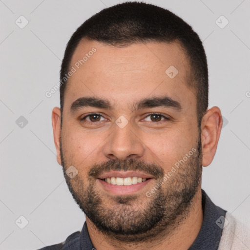 Joyful white young-adult male with short  brown hair and brown eyes