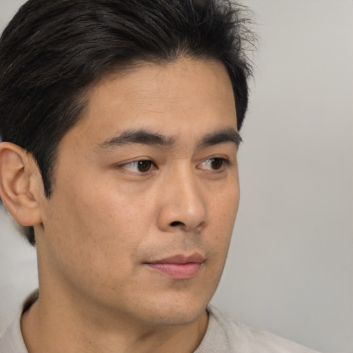 Neutral asian young-adult male with short  brown hair and brown eyes