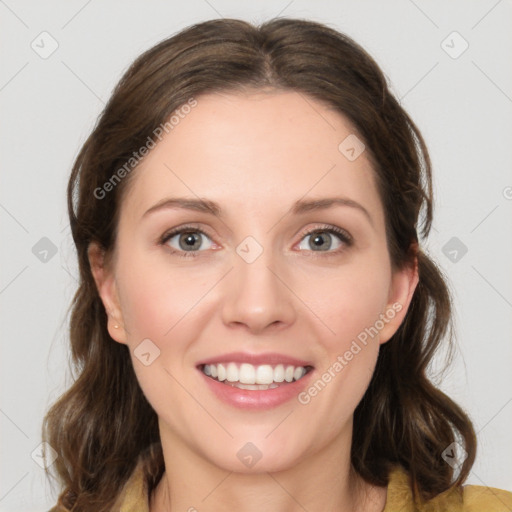 Joyful white young-adult female with medium  brown hair and green eyes