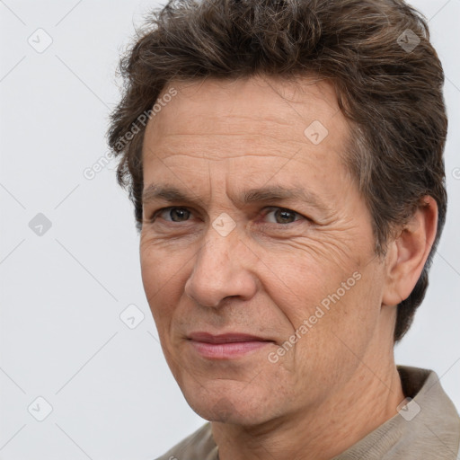 Joyful white middle-aged male with short  brown hair and brown eyes