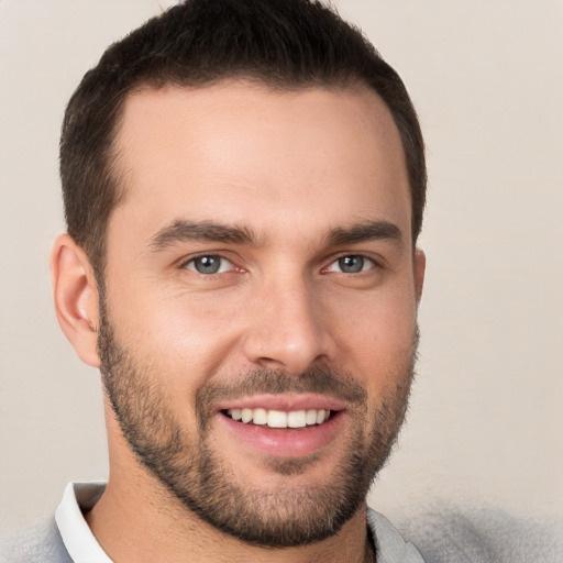 Joyful white young-adult male with short  brown hair and brown eyes