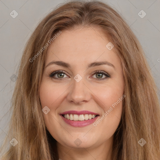 Joyful white young-adult female with long  brown hair and brown eyes