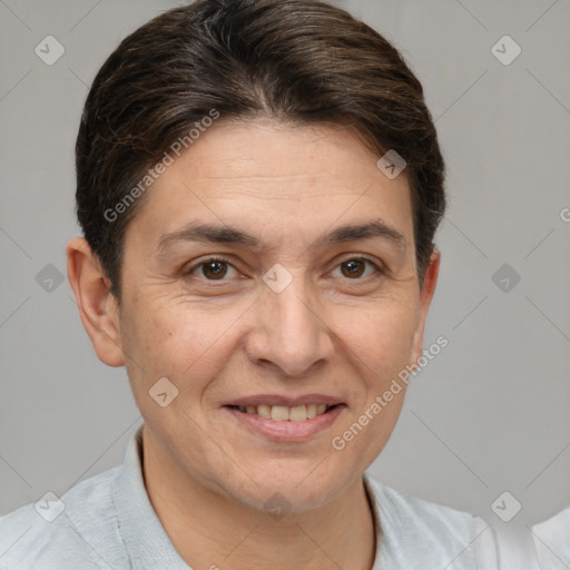 Joyful white adult female with short  brown hair and grey eyes