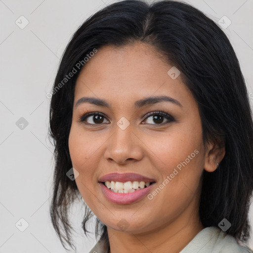 Joyful latino young-adult female with medium  brown hair and brown eyes