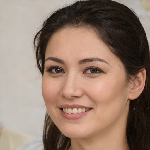 Joyful white young-adult female with medium  brown hair and brown eyes