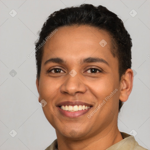 Joyful latino young-adult male with short  black hair and brown eyes