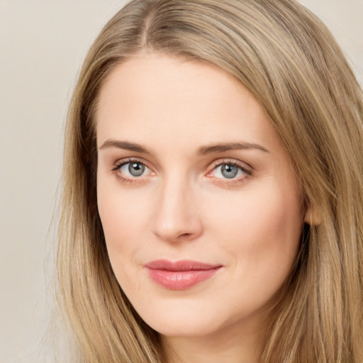 Joyful white young-adult female with long  brown hair and green eyes