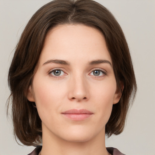 Neutral white young-adult female with medium  brown hair and green eyes