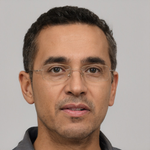 Neutral white adult male with short  black hair and brown eyes
