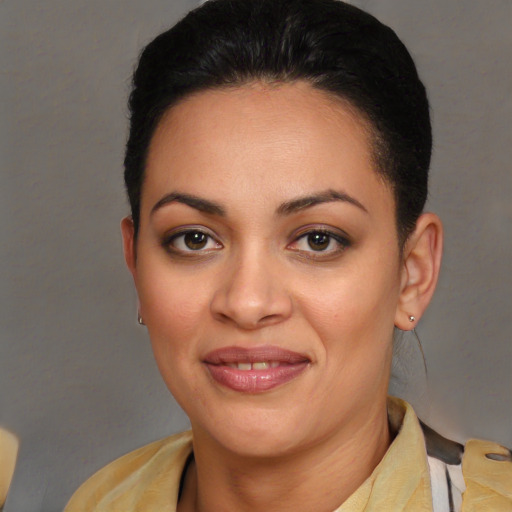 Joyful latino young-adult female with short  brown hair and brown eyes