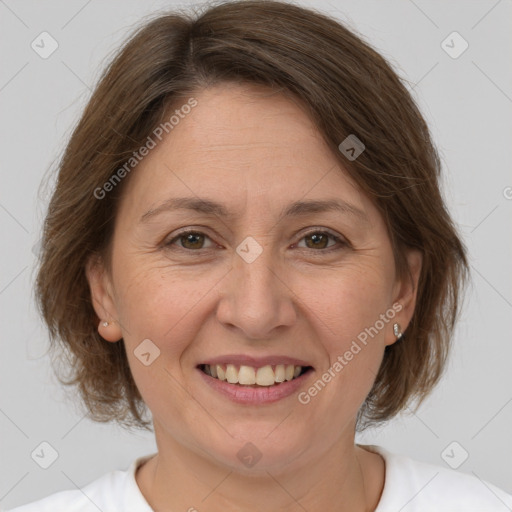 Joyful white adult female with medium  brown hair and brown eyes