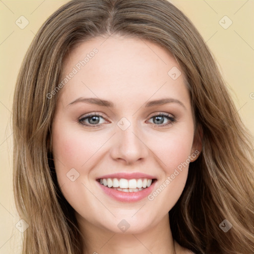 Joyful white young-adult female with long  brown hair and green eyes