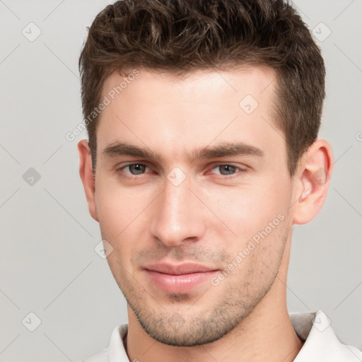 Neutral white young-adult male with short  brown hair and brown eyes