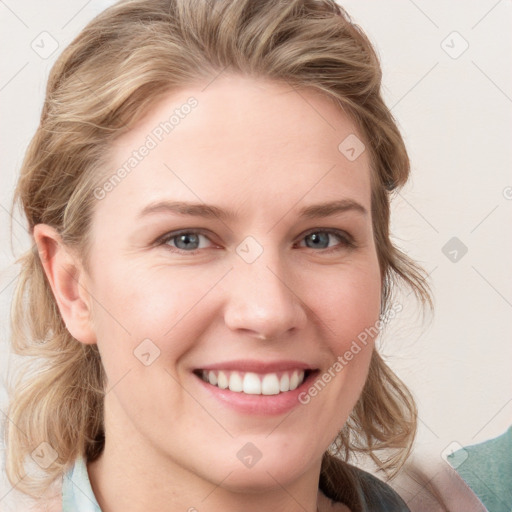 Joyful white young-adult female with medium  brown hair and blue eyes