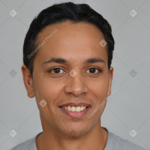 Joyful latino young-adult male with short  brown hair and brown eyes