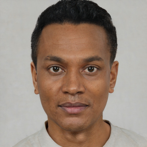 Neutral black young-adult male with short  black hair and brown eyes