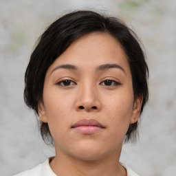 Neutral asian young-adult female with medium  brown hair and brown eyes