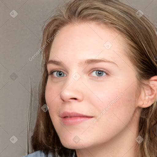 Joyful white young-adult female with long  brown hair and blue eyes