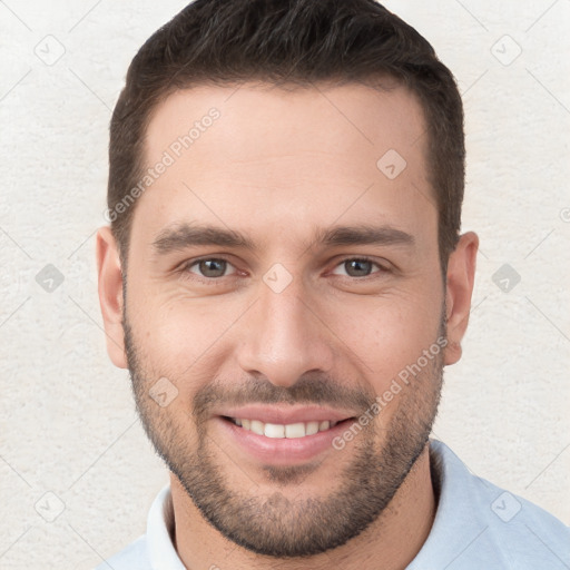 Joyful white young-adult male with short  brown hair and brown eyes