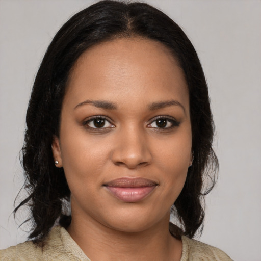 Joyful black young-adult female with medium  brown hair and brown eyes