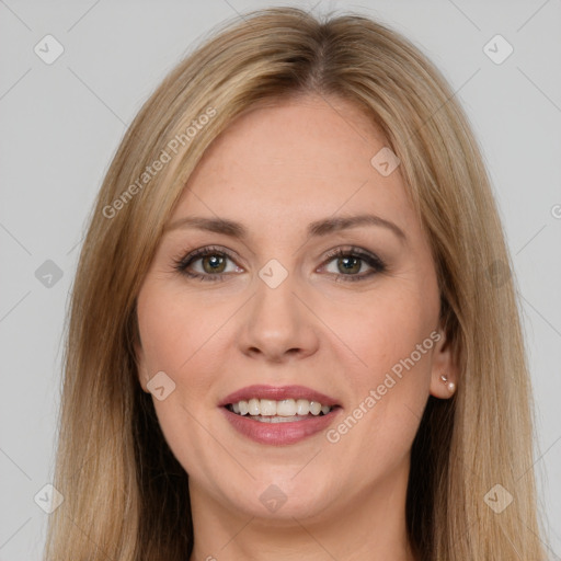 Joyful white young-adult female with long  brown hair and brown eyes