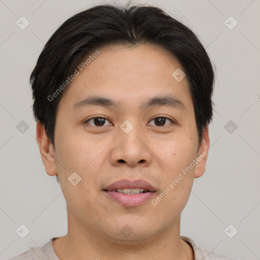 Joyful asian young-adult male with short  brown hair and brown eyes