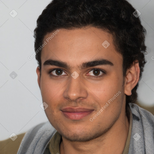 Joyful latino young-adult male with short  brown hair and brown eyes