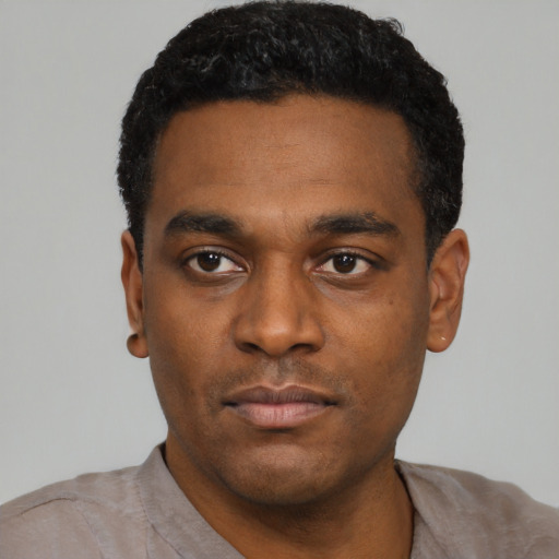Neutral black young-adult male with short  black hair and brown eyes