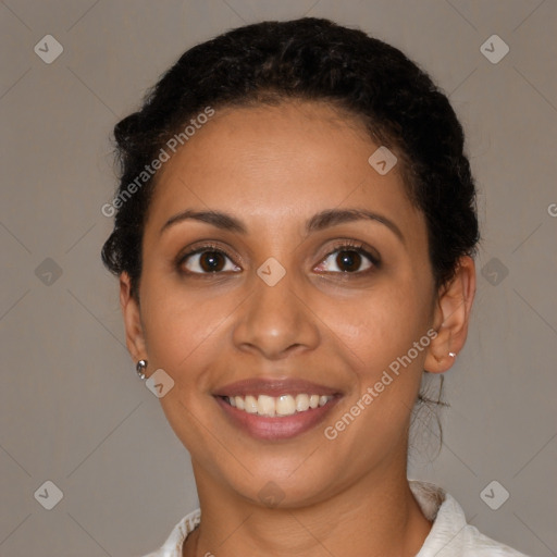 Joyful latino young-adult female with short  brown hair and brown eyes